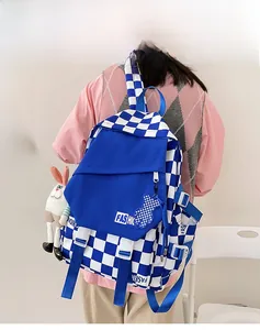 Blue and white checkered backpack with adjustable side straps and cute plush animal charms
