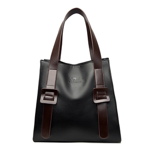 Large black pebbled leather tote bag with brown straps and kangaroo logo engraving