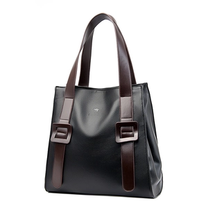Minimalist black lychee texture tote bag with brown leather handles and kangaroo logo