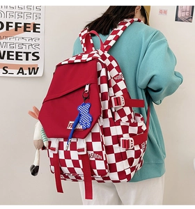 Fashionable red and white checkered backpack with cute bear pendant and plush rabbit charm