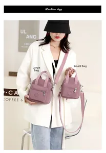 Comparison of large and small purple nylon crossbody bags with adjustable straps on model