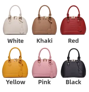 Showcase of six shell handbags with crocodile texture in various fashion colors