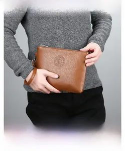 Brown leather men's clutch bag with lychee texture and metallic silver zipper detail