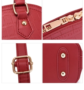Detailed views of red crocodile texture handbag with gold-tone hardware and metal feet