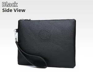 Close-up of black PU leather clutch bag featuring embossed logo and detachable wrist strap