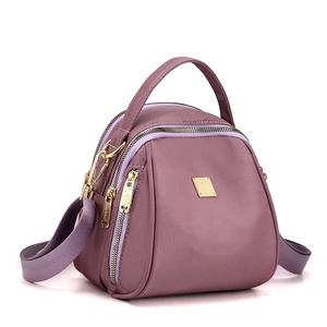 Zaino in nylon viola impermeabile con tre cerniere e dettagli metallici dorati