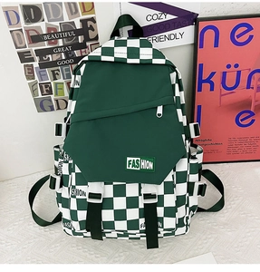 Detail of green checkerboard backpack featuring high-density canvas and buckle strap