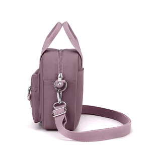 Purple nylon crossbody shoulder bag with silver zippers and multi-compartment design