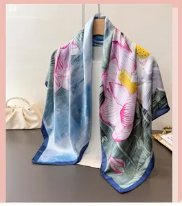 Detail of silk scarf with ink lotus floral pattern and elegant smooth satin texture