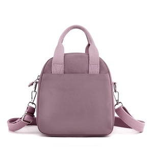 Lilac nylon crossbody bag with multi-pocket design and adjustable shoulder strap