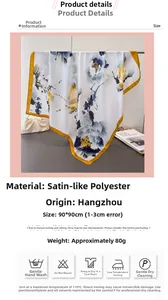 Detailed view of ink floral pattern on 90x90cm satin scarf with yellow borders