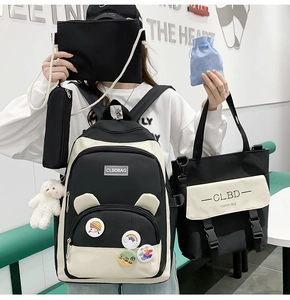 Five-piece black and white school backpack set with cute bear charm and badges