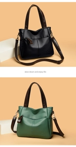 Detail of lychee pattern leather tote bag showing side pockets and wide shoulder strap