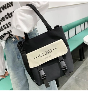 Detail of canvas tote bag featuring black and white contrast with fashion lettering
