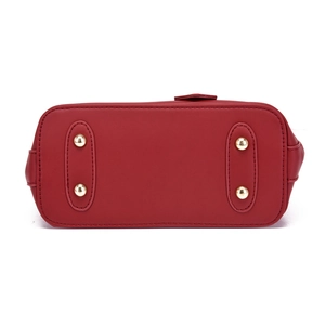 Red stone texture shell handbag featuring gold protective bottom metal feet studs