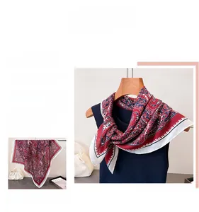 Detailed close-up of ethnic style silk scarf with red and blue paisley patterns