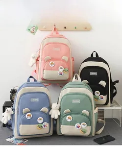 Set of four colorful student backpacks featuring bear-ear pockets and cute badges