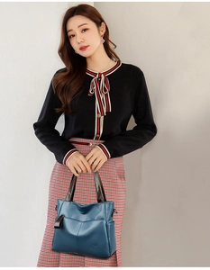 Blue PU leather tote bag with large capacity shown in a stylish fashion lifestyle setting