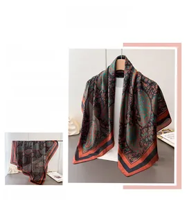 Detail view of paisley silk-feel large square scarf with elegant vintage patterns