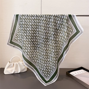 Elegant vintage chain pattern square silk scarf in dark green and grey hanging display