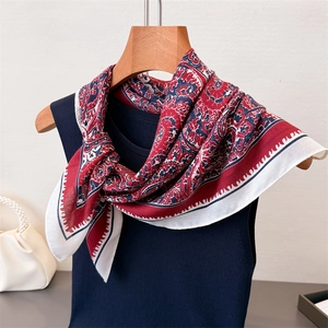 Elegant paisley cotton linen blend scarf with vintage red and blue patterns on a hanger