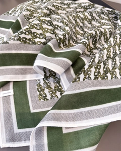 Macro shot showing the 100% polyester fabric texture and vintage chain pattern detail
