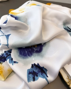 Detailed view of the smooth ink floral print silk texture fabric with fine stitching