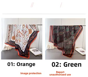Detail of silk-like satin scarves featuring orange horsebit and green paisley prints