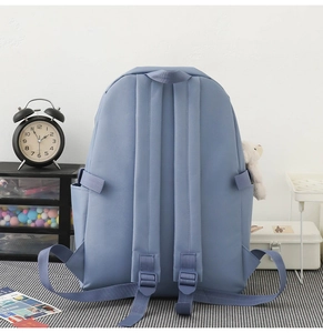 Rear view of Morandi blue school backpack featuring ergonomic S-shaped shoulder straps