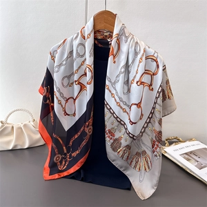 Silk-feel printed square scarf featuring chain horsebit patterns and orange borders
