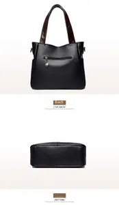 Detailed view of the back zipper pocket and sturdy base of a black pebble leather tote