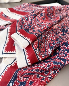 Close-up of vintage paisley pattern on soft cotton-linen blend fabric with rich textures