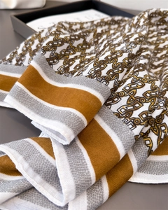 Close-up of vintage chain pattern scarf showing herringbone weave and striped border