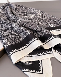 Close-up of black and white paisley pattern on cotton-linen texture square scarf