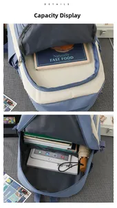 Detail showing the large capacity interior of the blue and white canvas student backpack