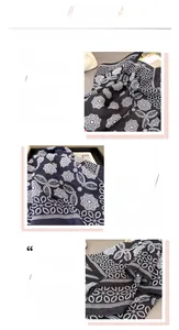 Detail view of herringbone weave texture and rolled hem on black mandala printed scarf