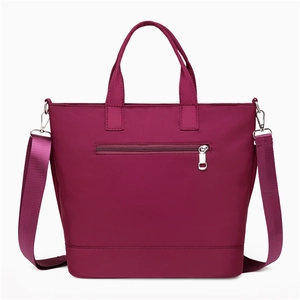 Deep purple nylon tote bag with adjustable shoulder strap and back zipper pocket