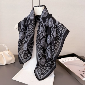 Elegant black and white herringbone mandala floral scarf on a mannequin