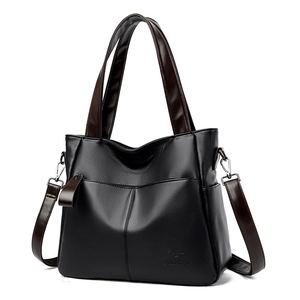 Large black lychee texture tote bag with brown handles and adjustable shoulder strap
