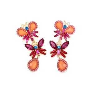 Close-up of vibrant crystal butterfly earrings with multi-colored rhinestones and gold plating