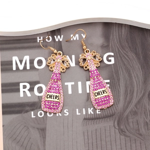 Sparkling pink crystal champagne bottle drop earrings featuring gold Cheers engraving