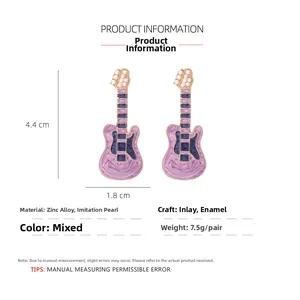 Detail view of purple guitar earrings with faux pearls and precise dimension markers