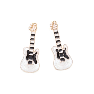 Detail of guitar earrings with gold metal frame, enamel finish and white faux pearls