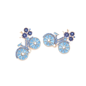 Detail of bicycle earrings with blue enamel flowers, crystals, and faux pearl accents