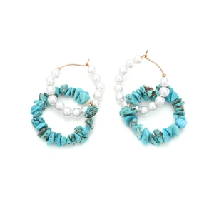 Detail of bohemian double hoop earrings with white pearls and blue turquoise stones