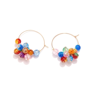Golden hoop earrings featuring colorful cracked-glass beads in a minimalist round design