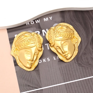 Golden vintage relief face earrings with artistic goddess portrait in minimalist style