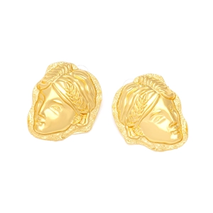Detailed view of gold relief earrings featuring classical Greek goddess face design