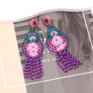 Boucles d'oreilles bohèmes en cristal et fleurs perlées avec franges bleues