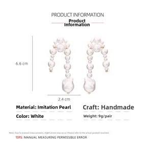 Detailed view of handmade baroque pearl drop earrings with 6.6x2.4cm size specifications